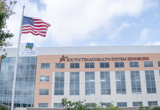 exterior of STHS edinburg with a flag raised