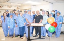 Surgical staff celebrating Dr. Saggi with cupcakes and balloons
