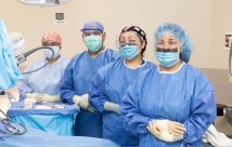 Doctors standing in operating room 