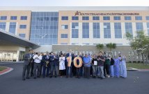 STHS Edinburg staff posing with numeric 10 balloons